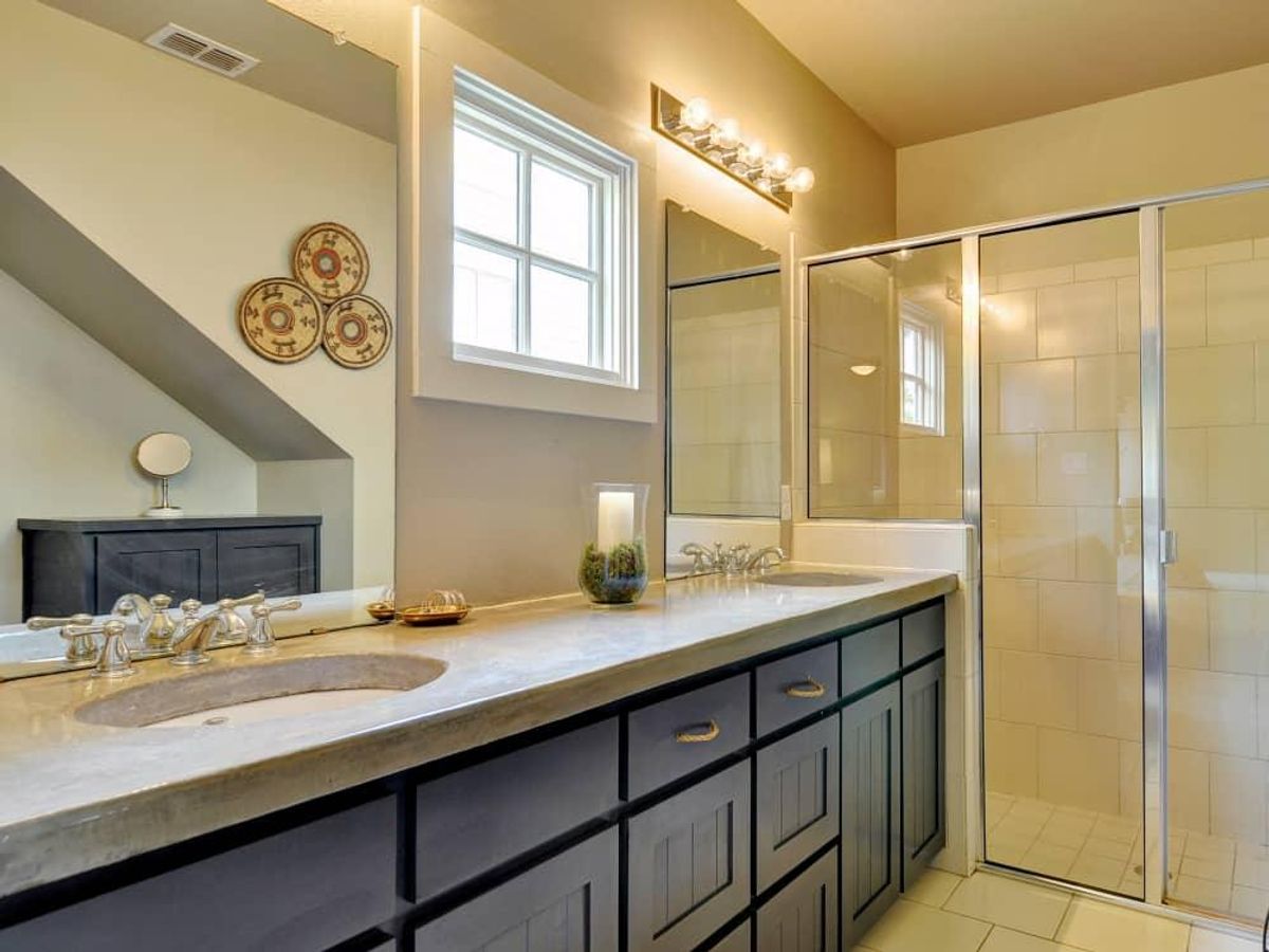 The master bathroom has dual vanities and a spacious shower