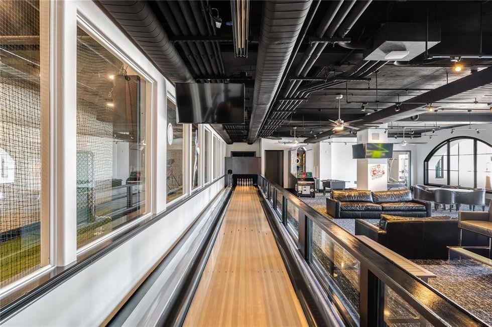 A look at the single-lane bowling alley, game room and adjoining batting cage.