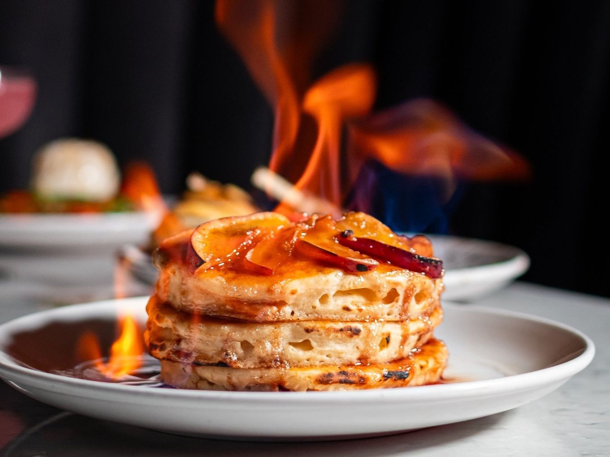 A stack of pancakes on fire