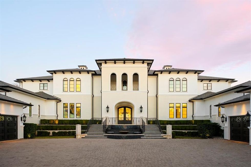 A wide-angle view of the transitional Mediterranean mansion at 1469 Sunshine Lane.