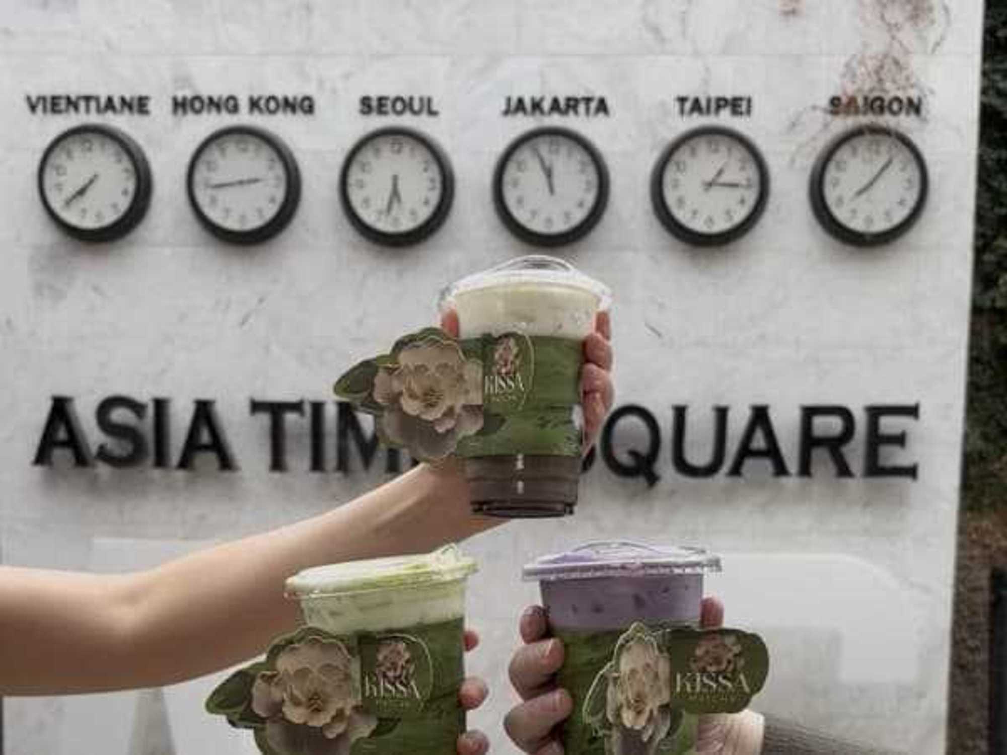 An assortment of iced matcha specialty drinks from Kissa Matcha, served in custom floral cup sleeves.