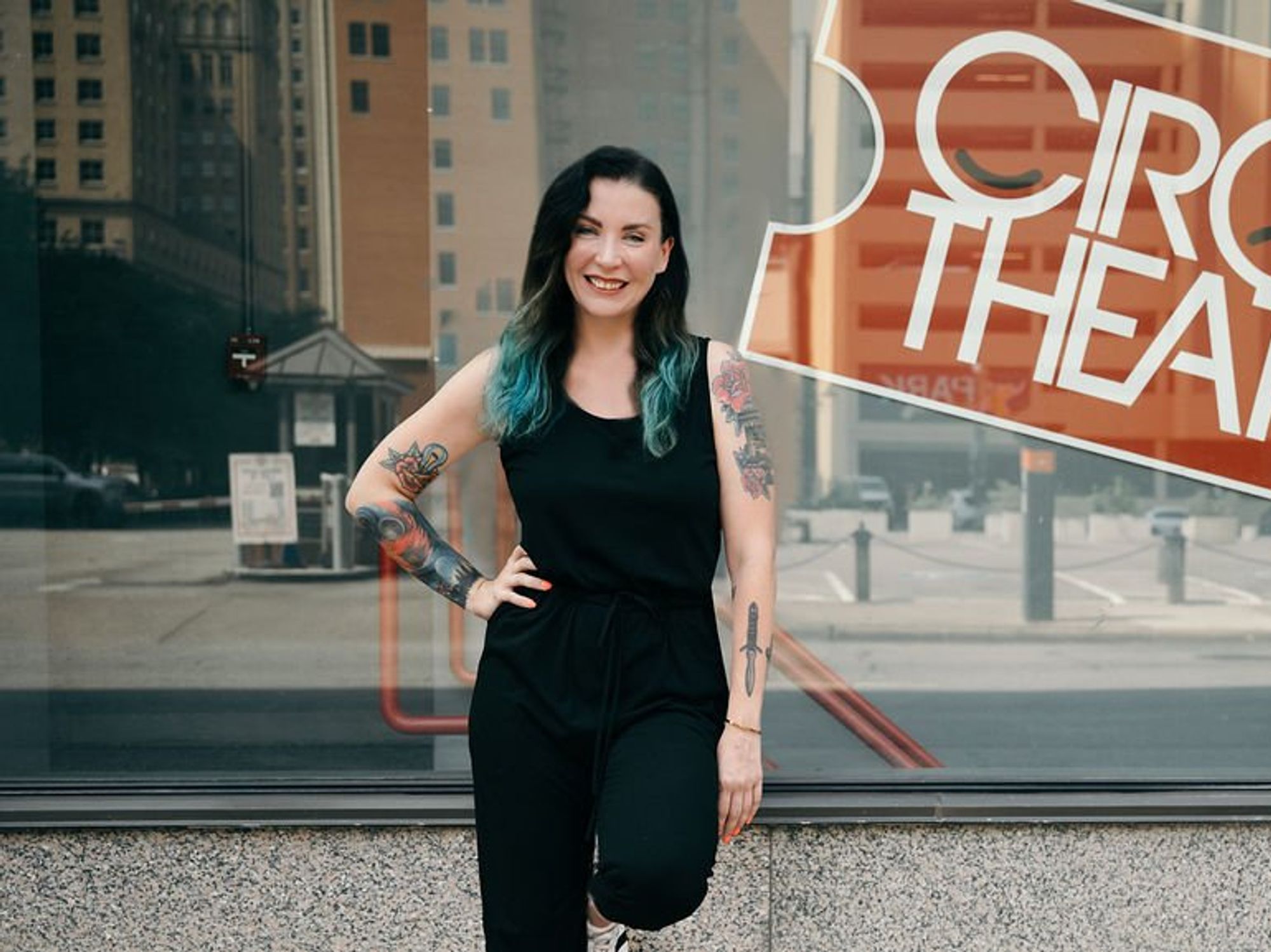 Ashley H. White in front of Circle Theatre