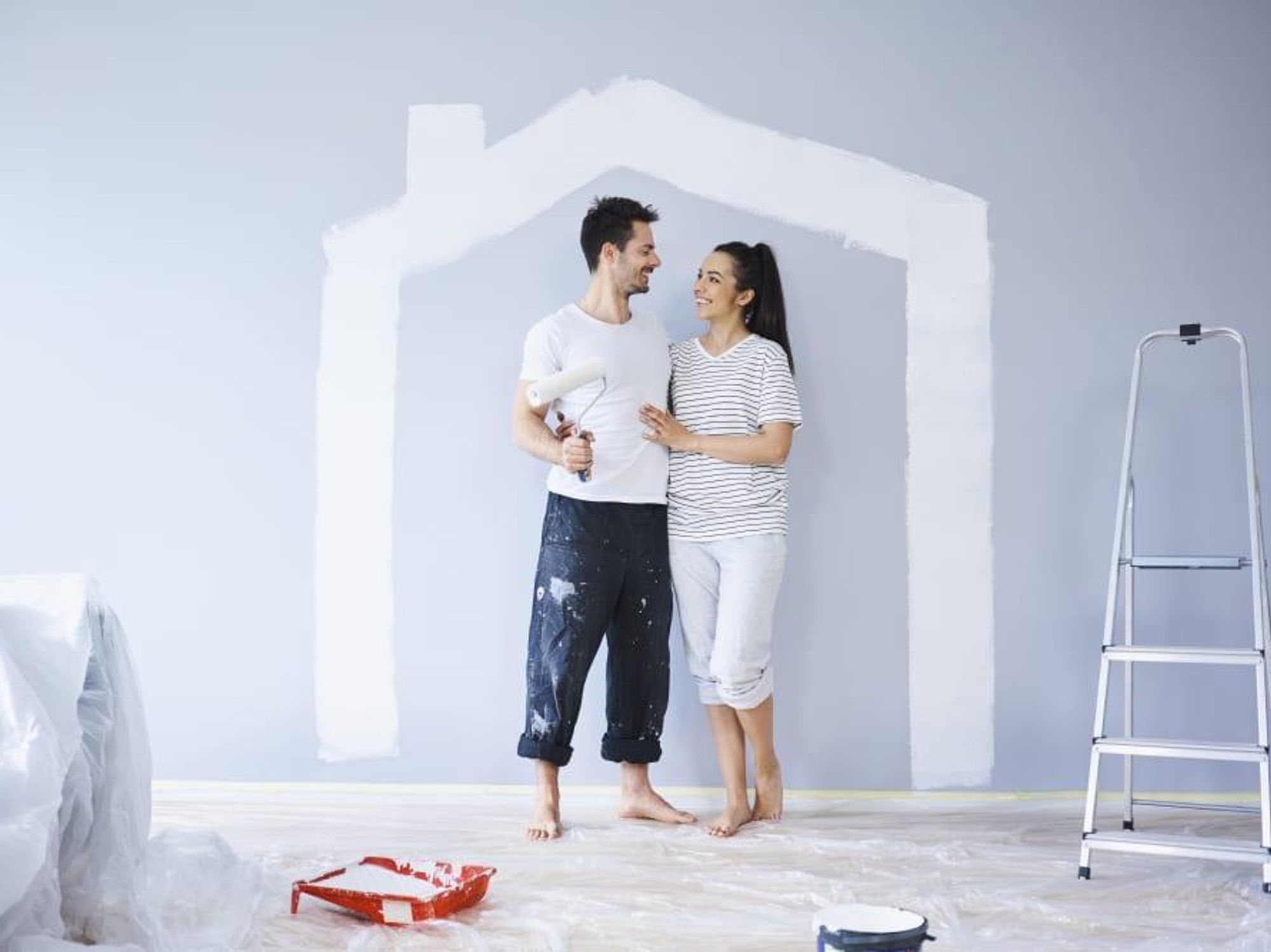 Couple painting new house
