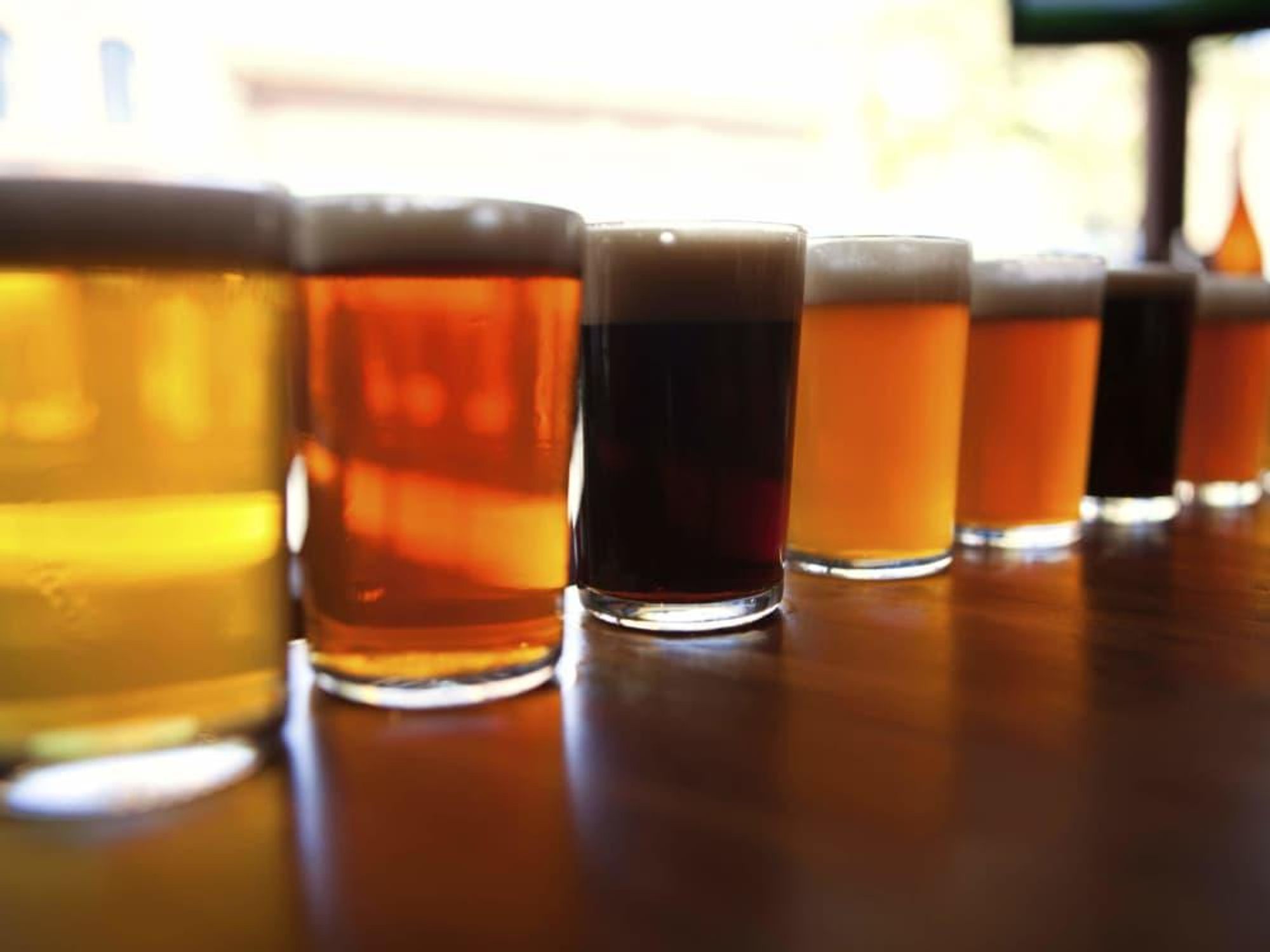 Craft beers along a bar