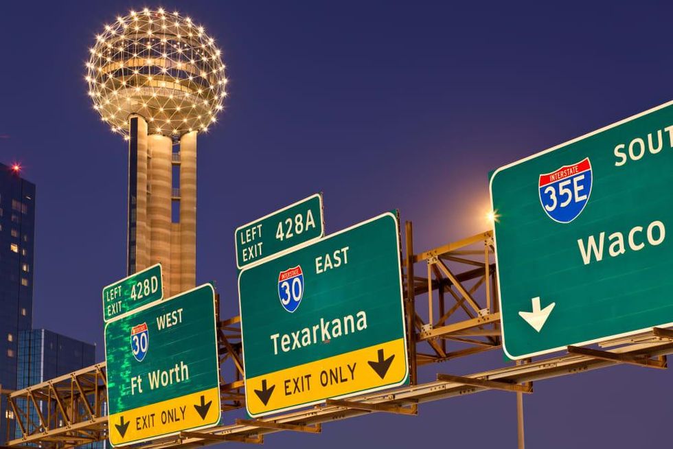 Dallas highway signs with Reunion Tower