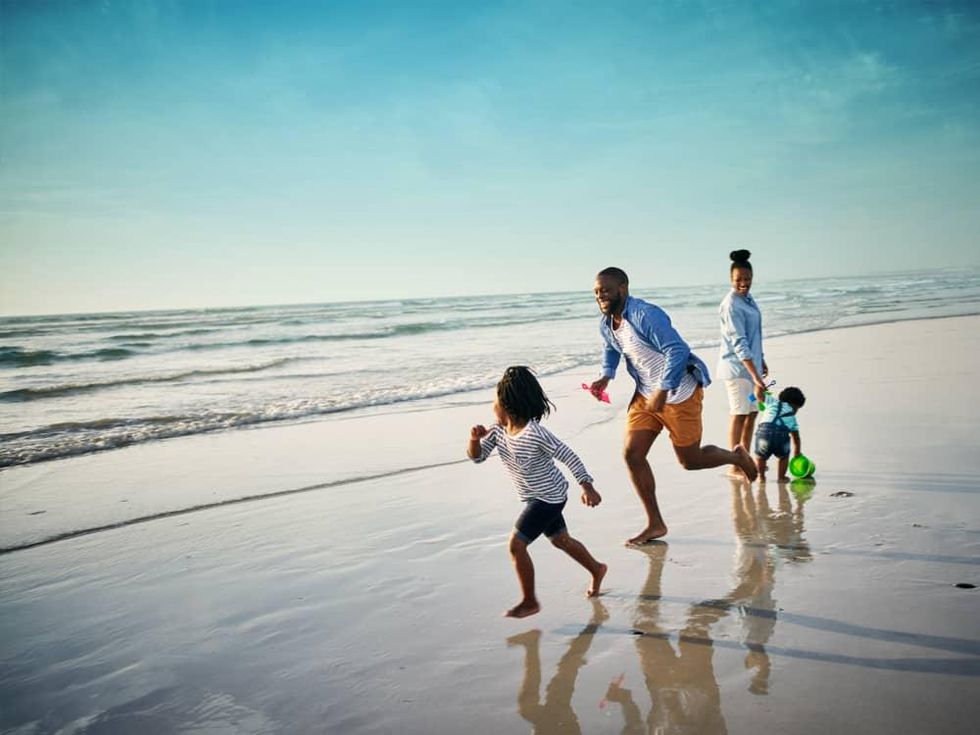 Family running on the beach at South Padre Island