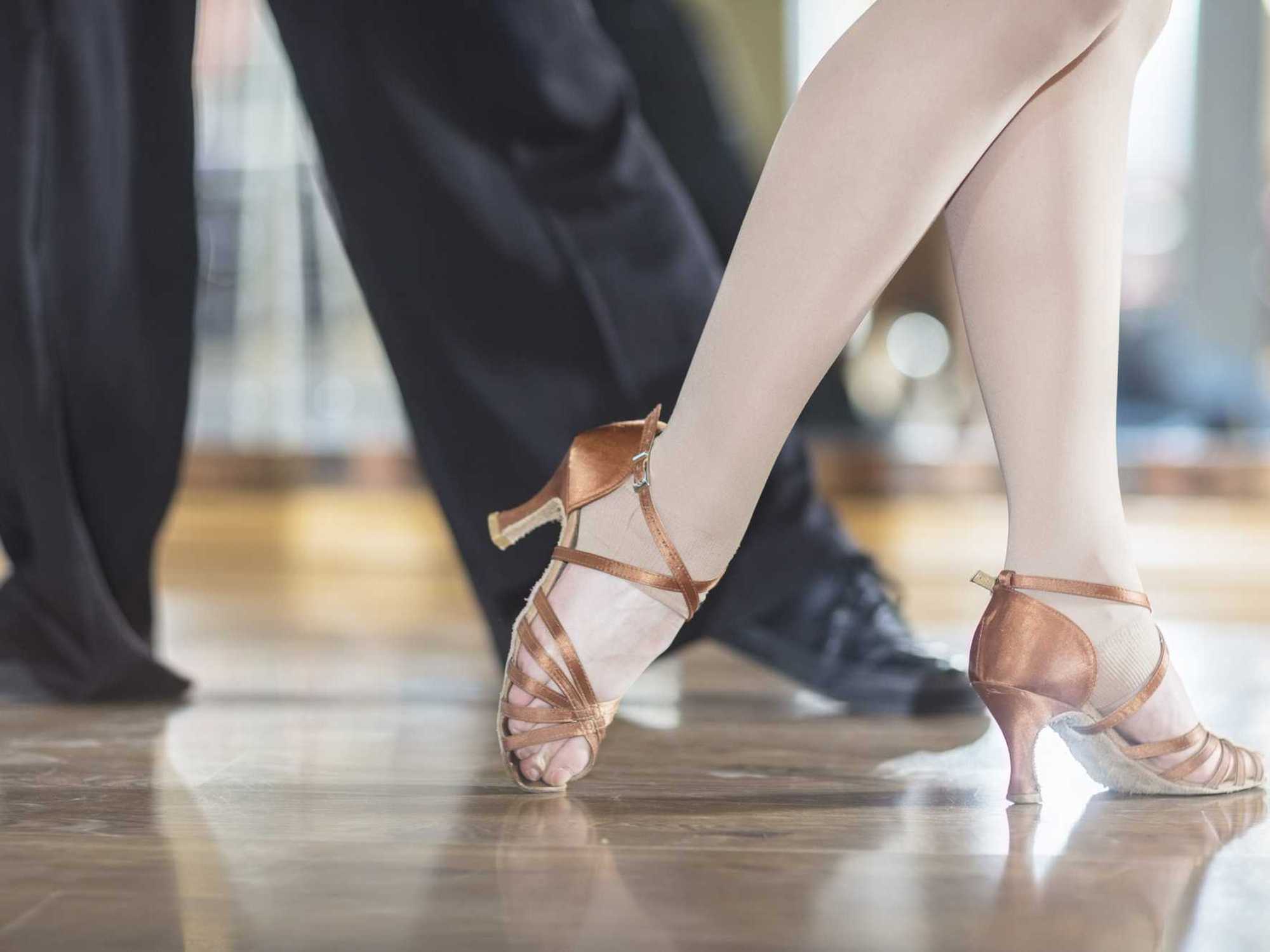 Feet of dancing couple in studio