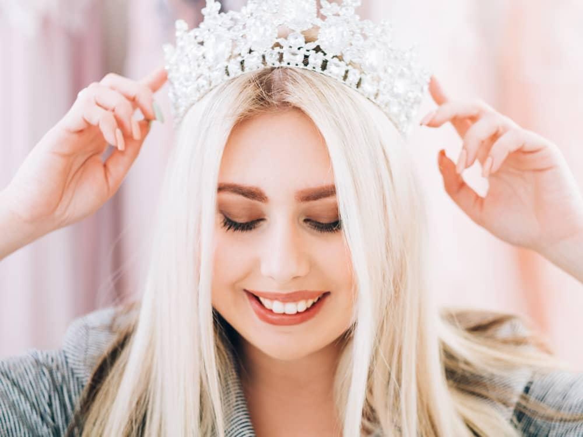 Girl putting on tiara