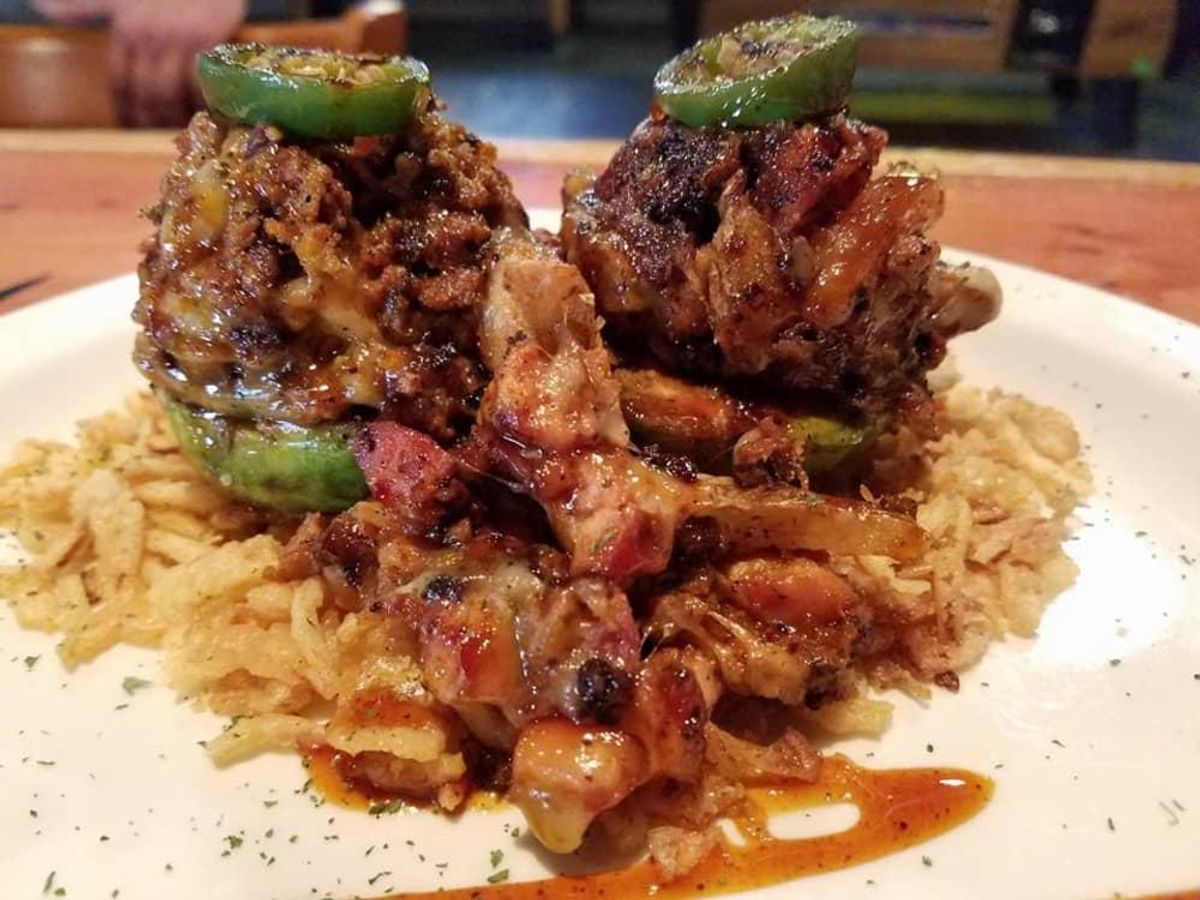 The Grilled Stuffed Avocado at Spice Rack Bar & Grille is packed with