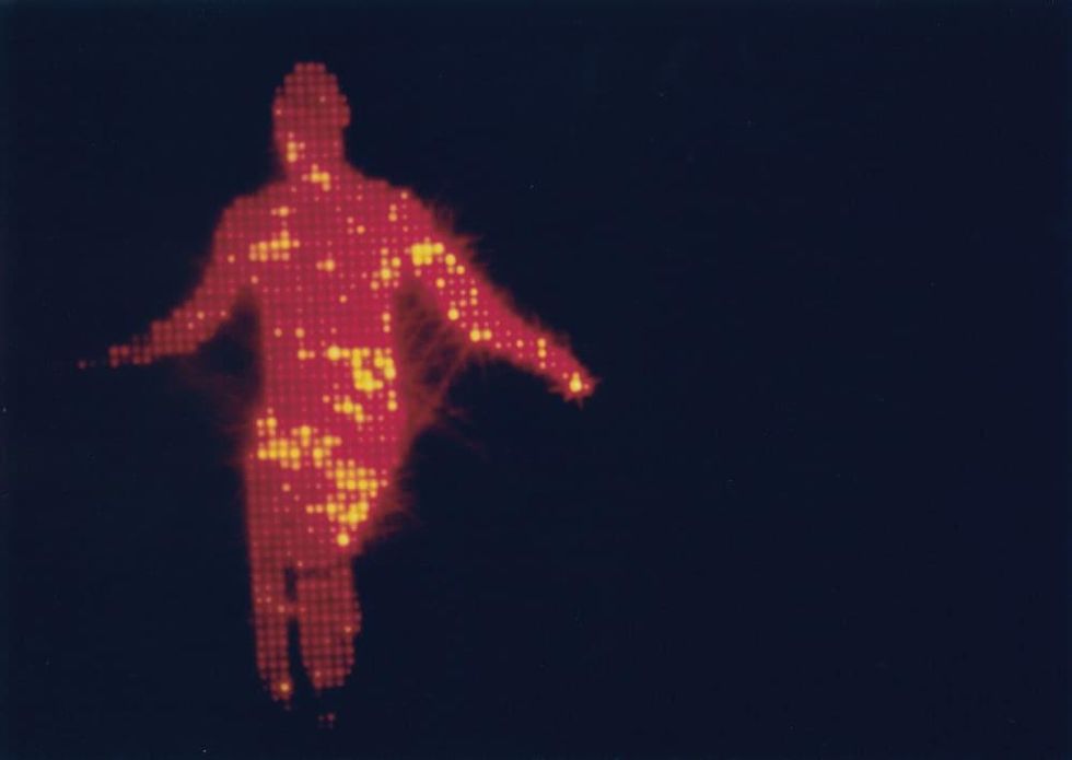 Jack Goldstein, The Jump, 1978 (film still). 16 mm film, color, silent projection, and two black light tubes; 26 seconds