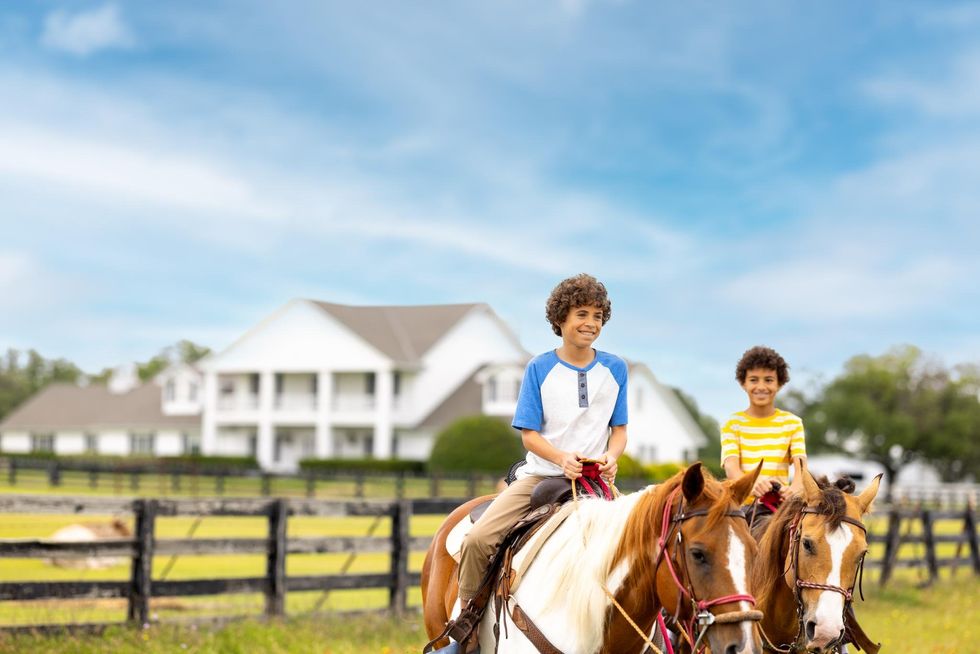 Kids riding horses at Southfork Ranch