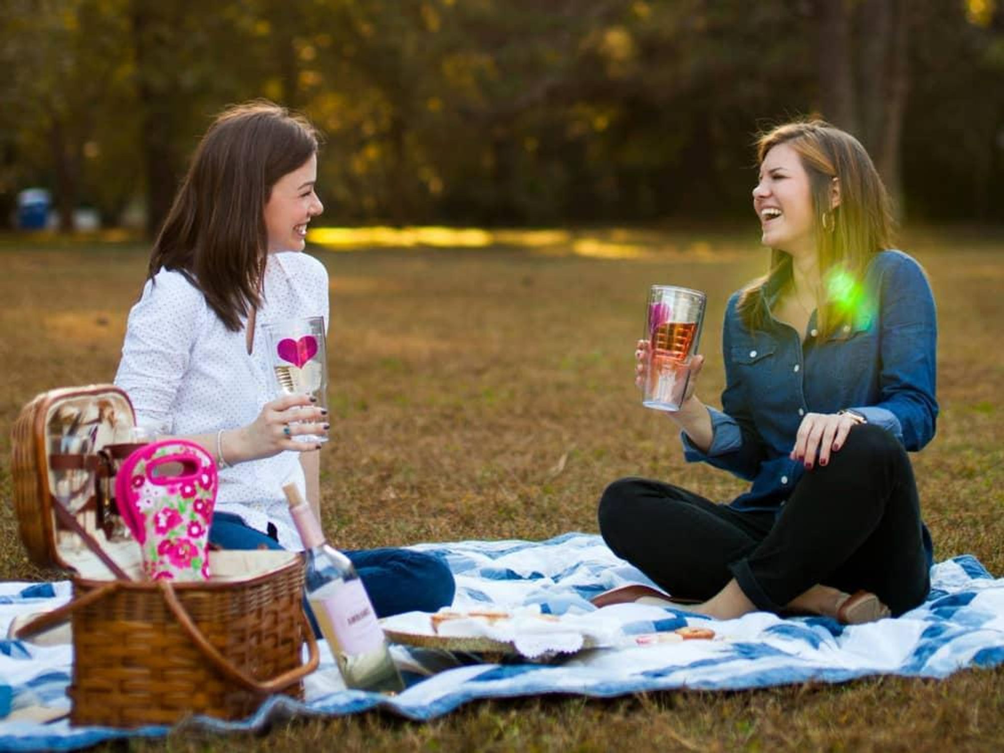 Ladies picnicking with Tervis tumblers