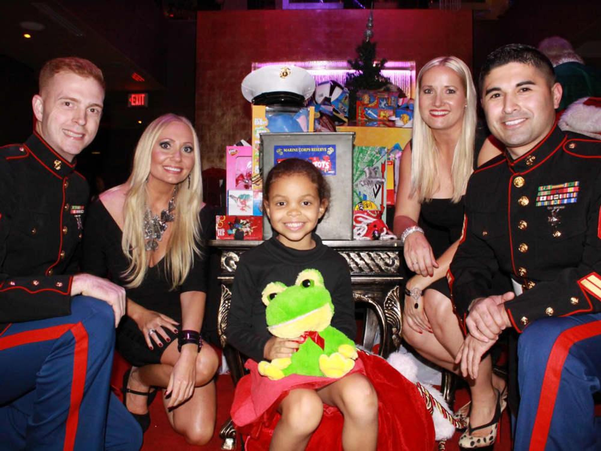 Lori Lemon Geshay and Nicole Brende, Toys for Tots local area representatives and Marines, along with our littlest guest, Ellie Rose Bynam at Mr. Peeples' Toys for Tots Holiday Toy Drive December 2013