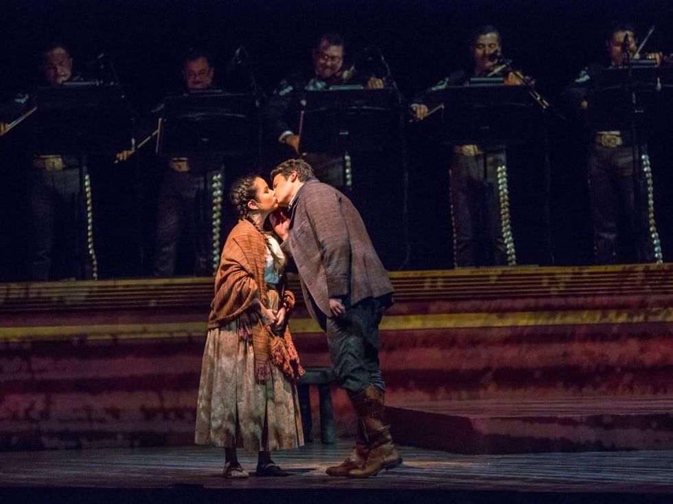 Luis (Daniel Montenegro, right) kisses Amorita (Abigail Santo Villalobos) in \u2018El Pasado Nunca se Termina\u2019, Fort Worth Opera