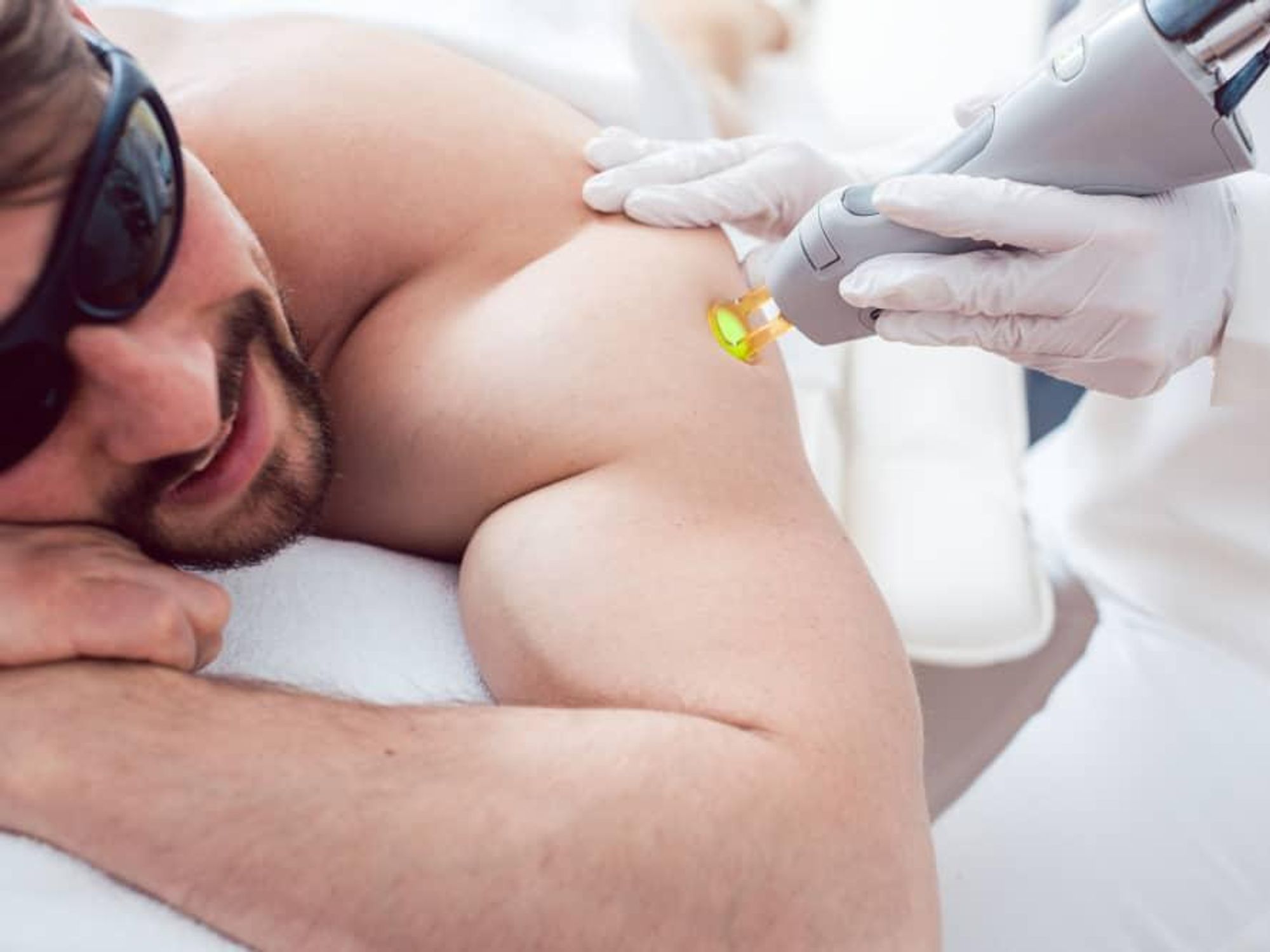 Man receiving laser hair removal