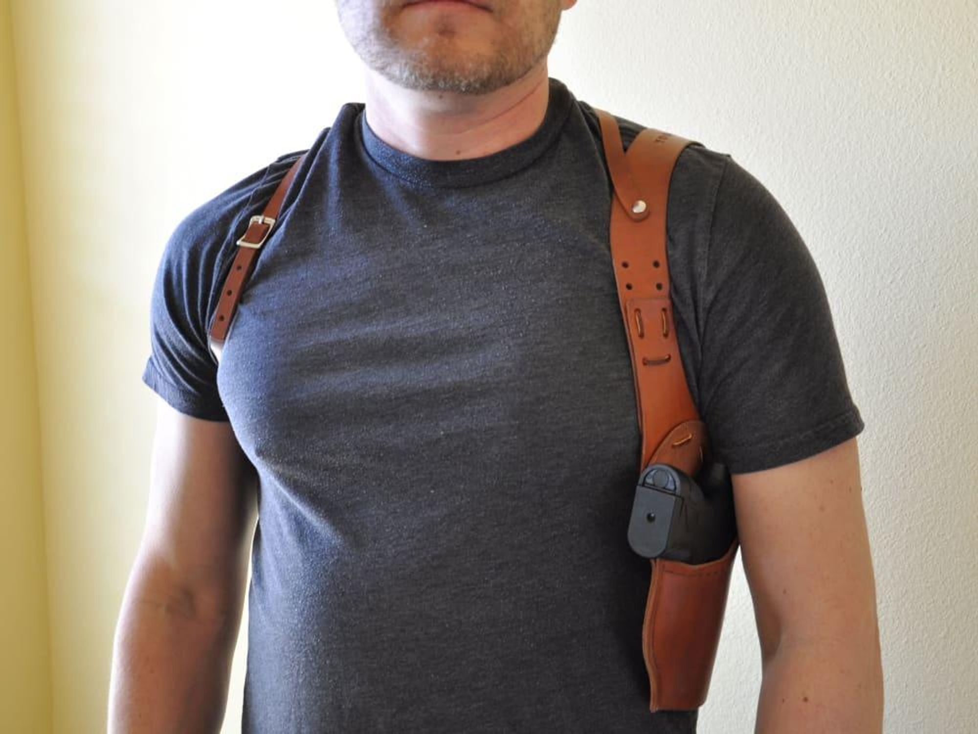 Man with pistol in shoulder holster