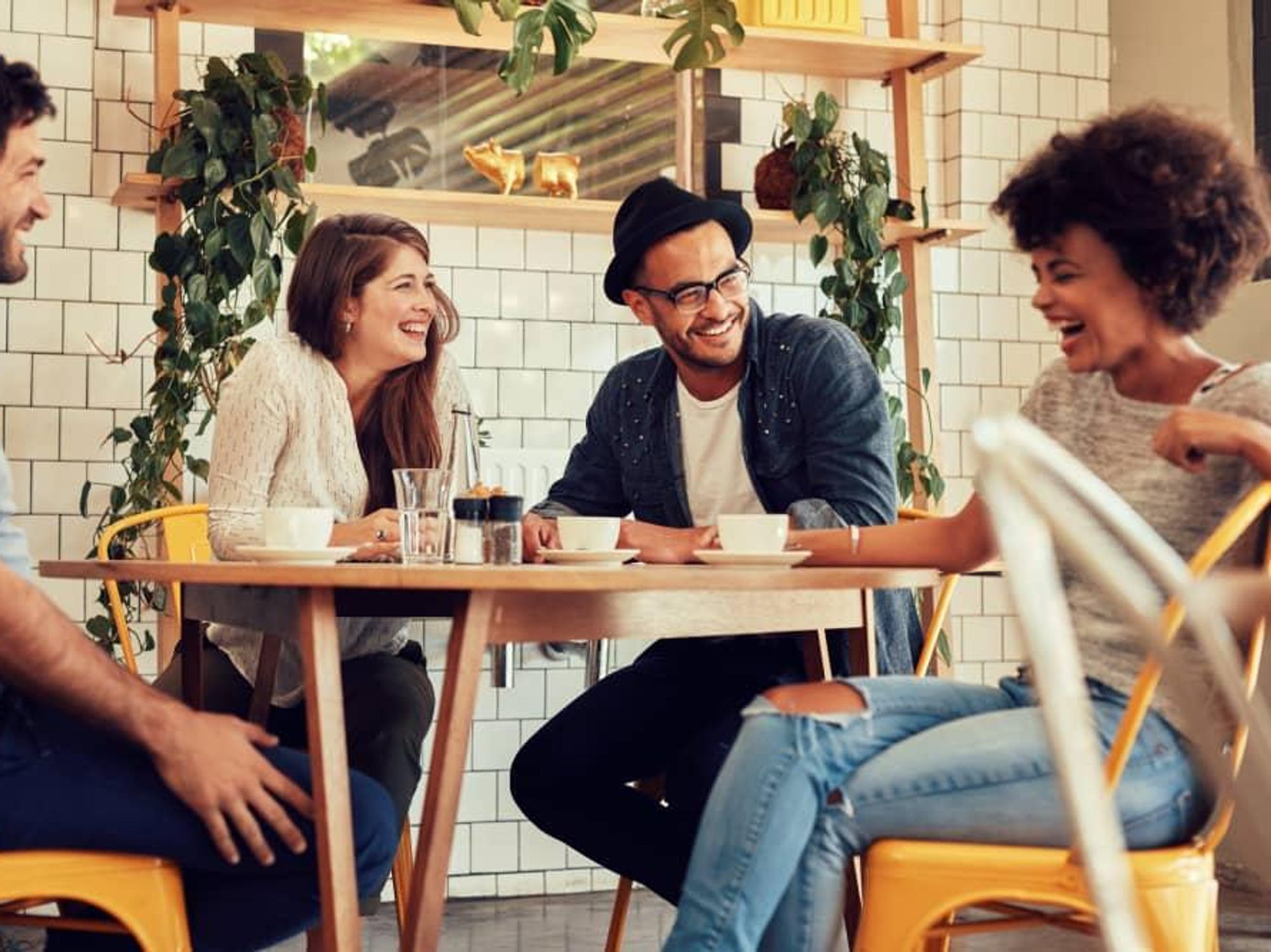 People laughing at a bar