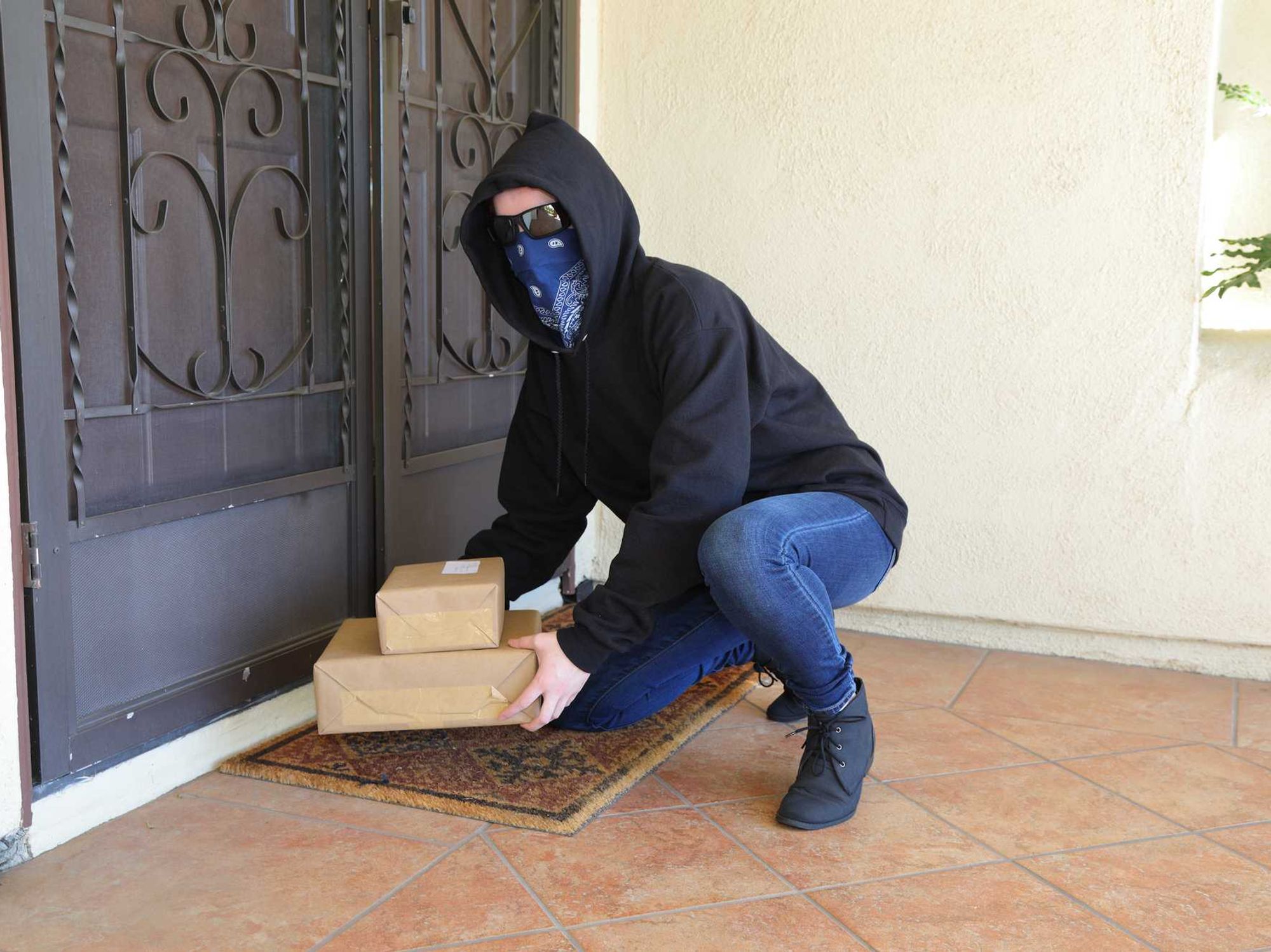 Porch Pirate Person in Glasses Steals Packages