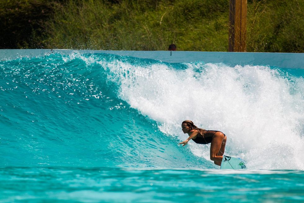 surfer woman fake wave Wavegarden