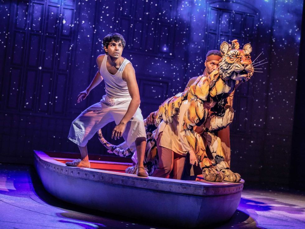 Taha Mandviwala and puppeteers Anna Leigh Gortner, Shiloh Goodin and Toussaint Jeanlouis in the National Tour of Life of Pi