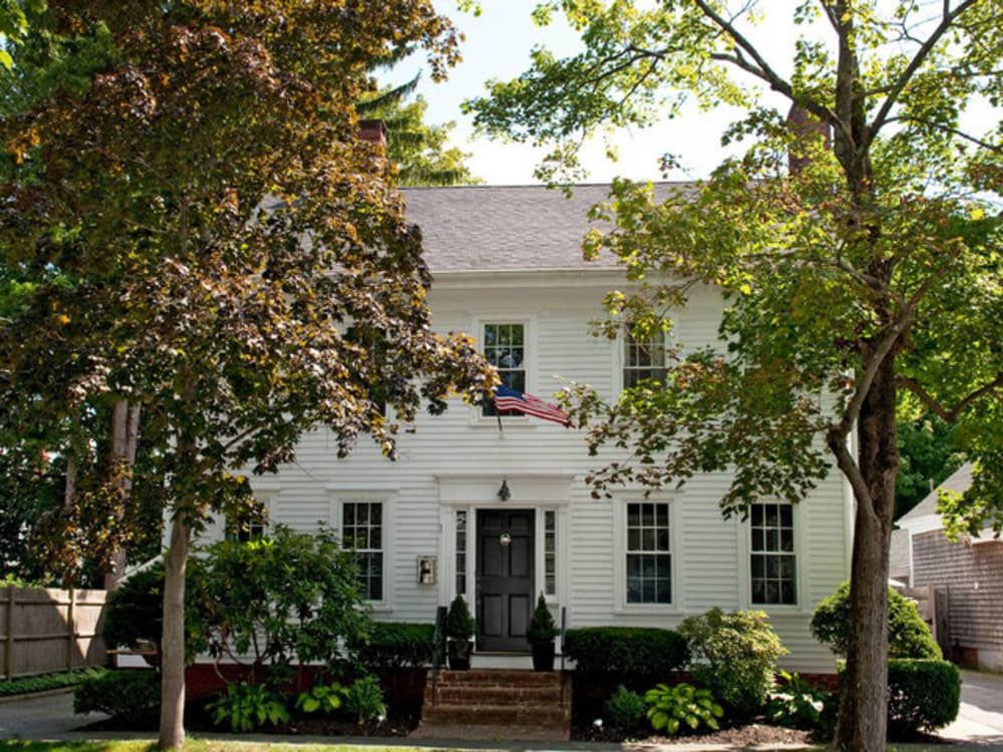 Traditional home with American flag