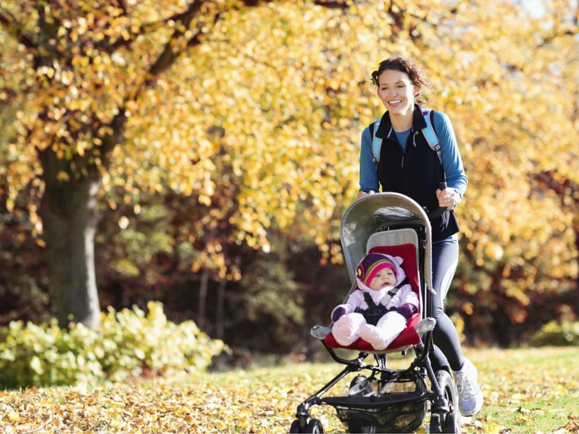 Woman jogging with baby