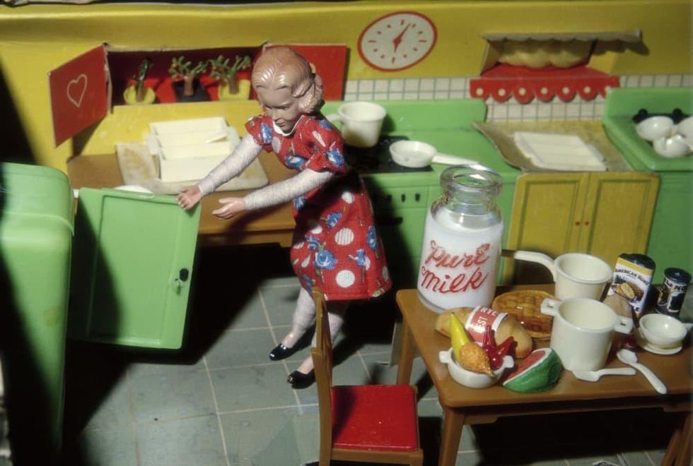 Woman Opening Refrigerator/Milk to the Right