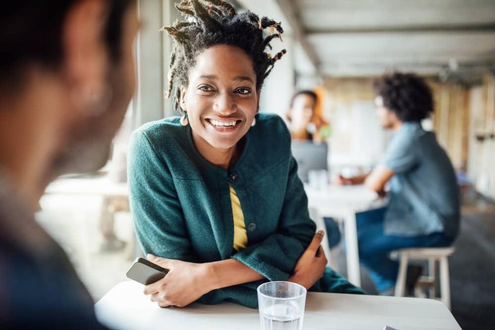 Woman smiling at friend