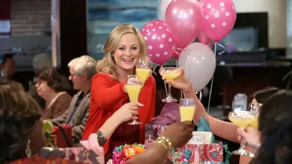 women with mimosas celebrating Galentine's Day